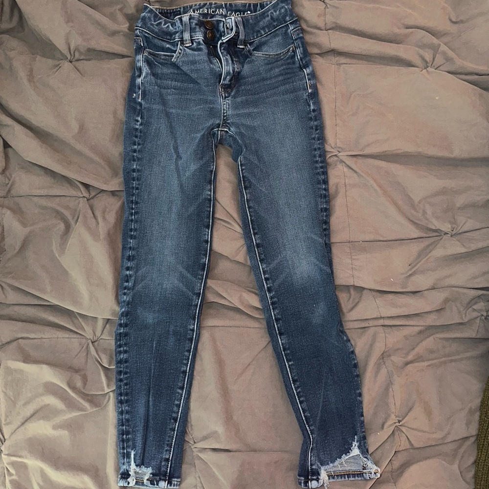 American Eagle Outfitters Blue Skinny Jeans with Distressed Hem